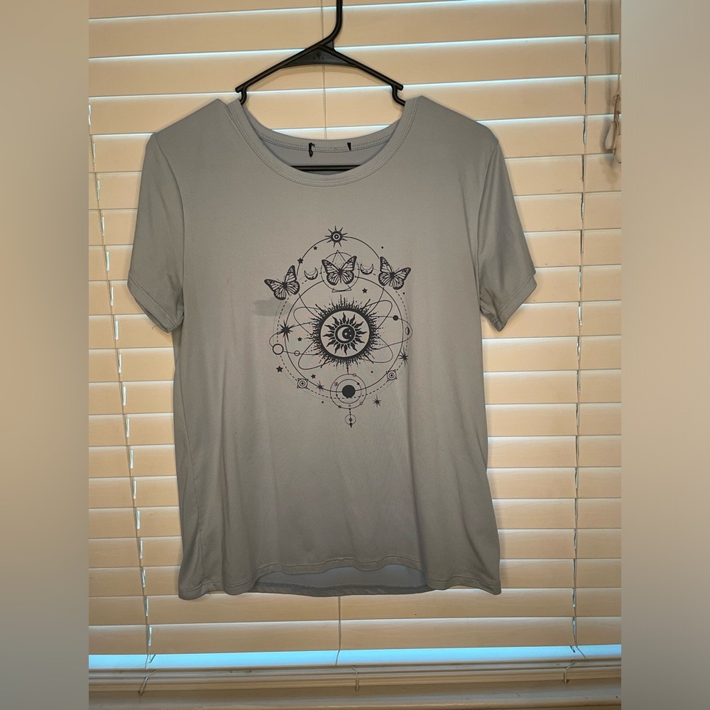 Beautiful light blue tee with butterfly design